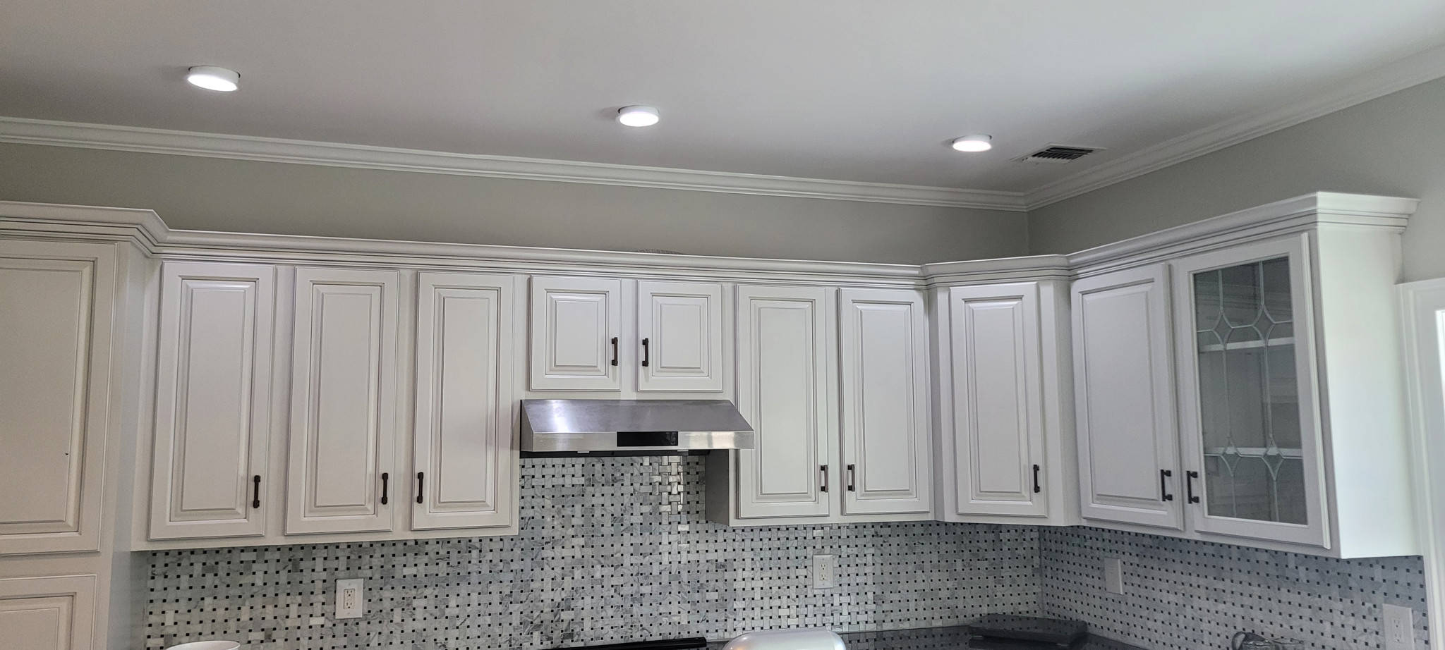 Cream cabinets with crown molding