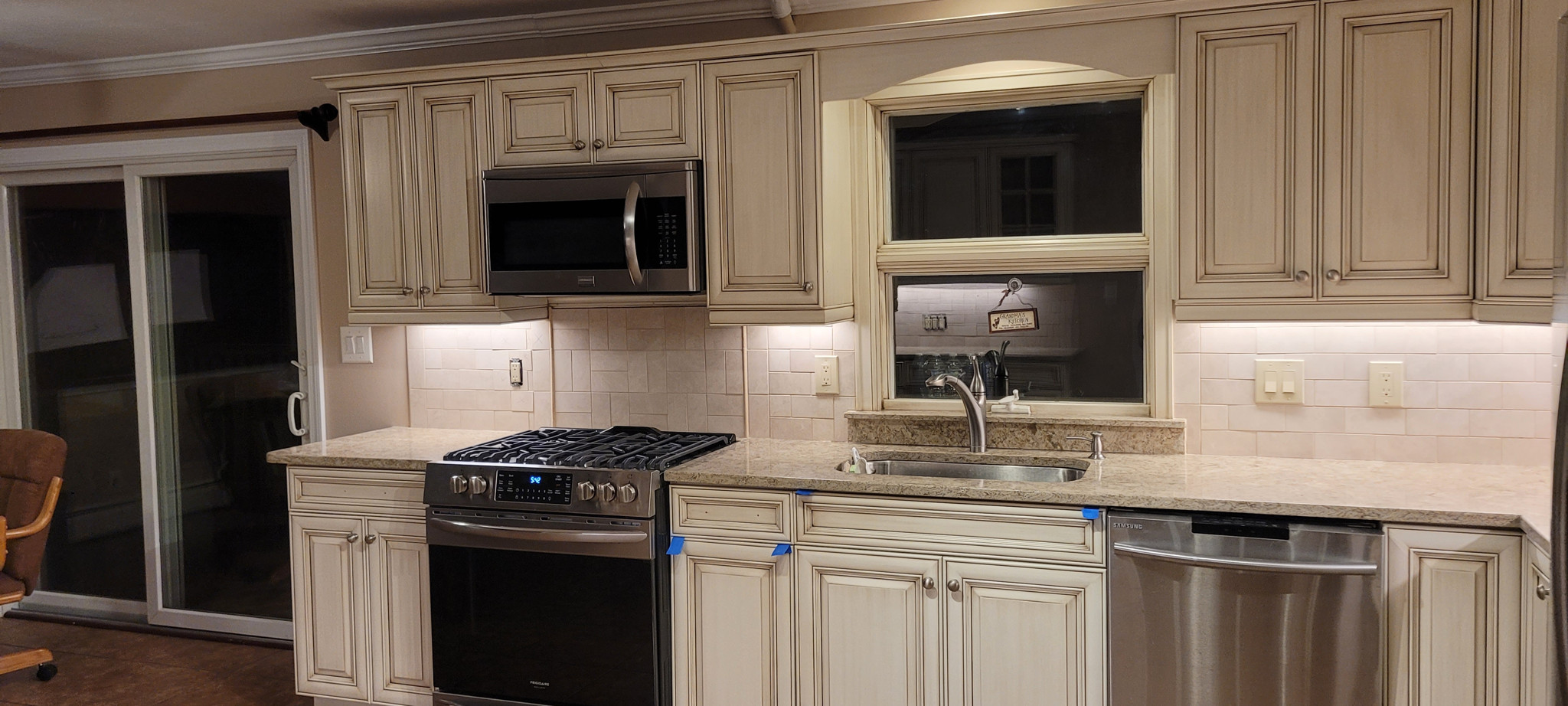 Cream cabinets with stainless appliances