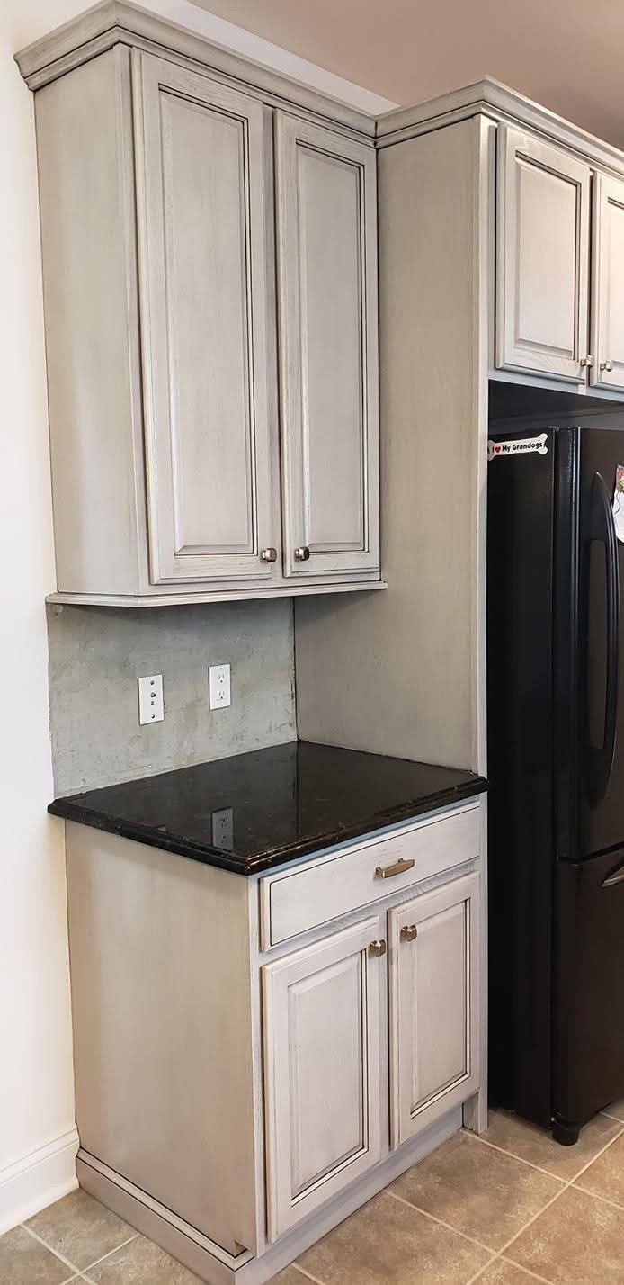 Kitchen cabinet doors and frames with an antique gray finish.