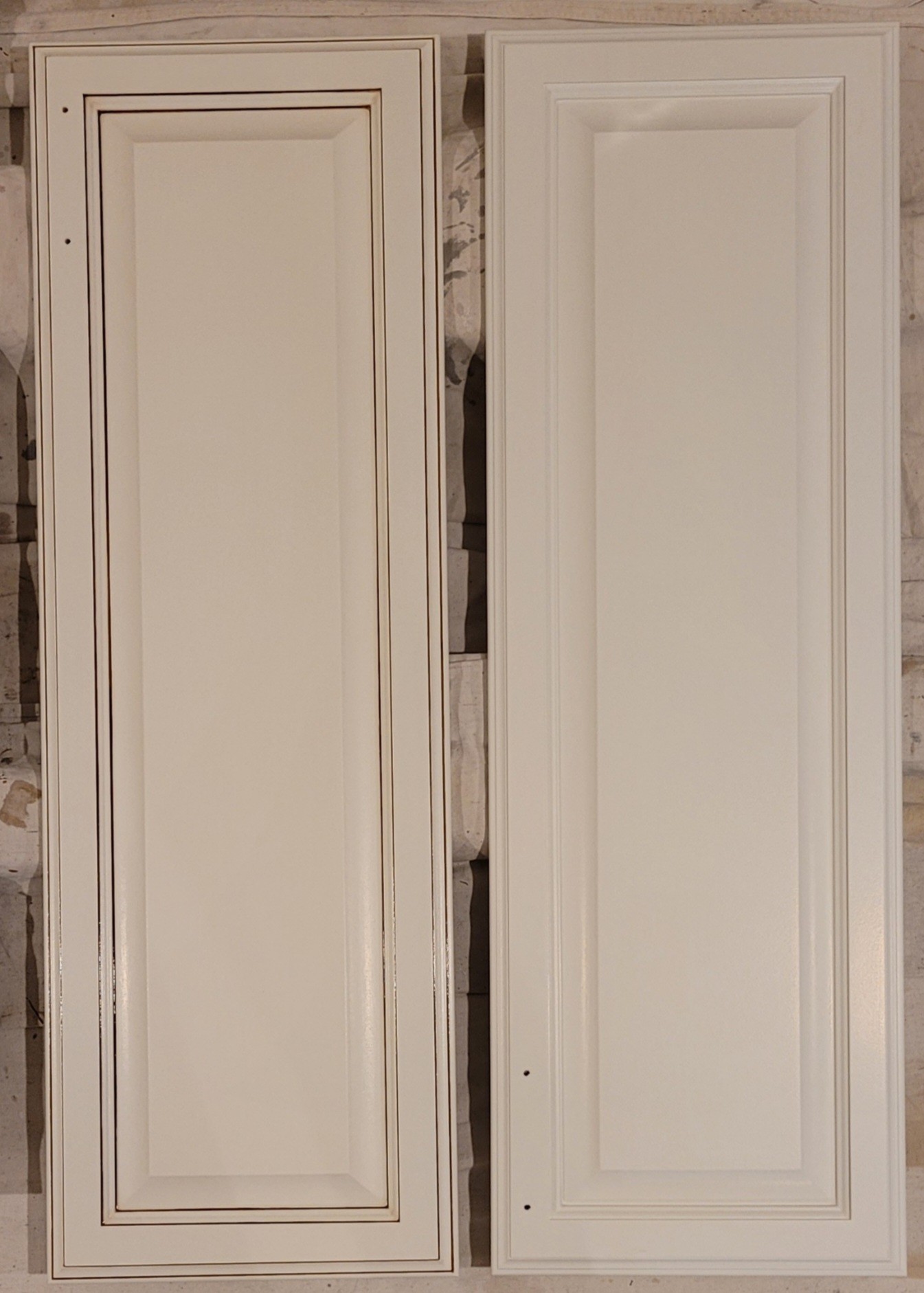 Kitchen cabinet doors, one with existing antiquing glaze, the other refinished off-white.