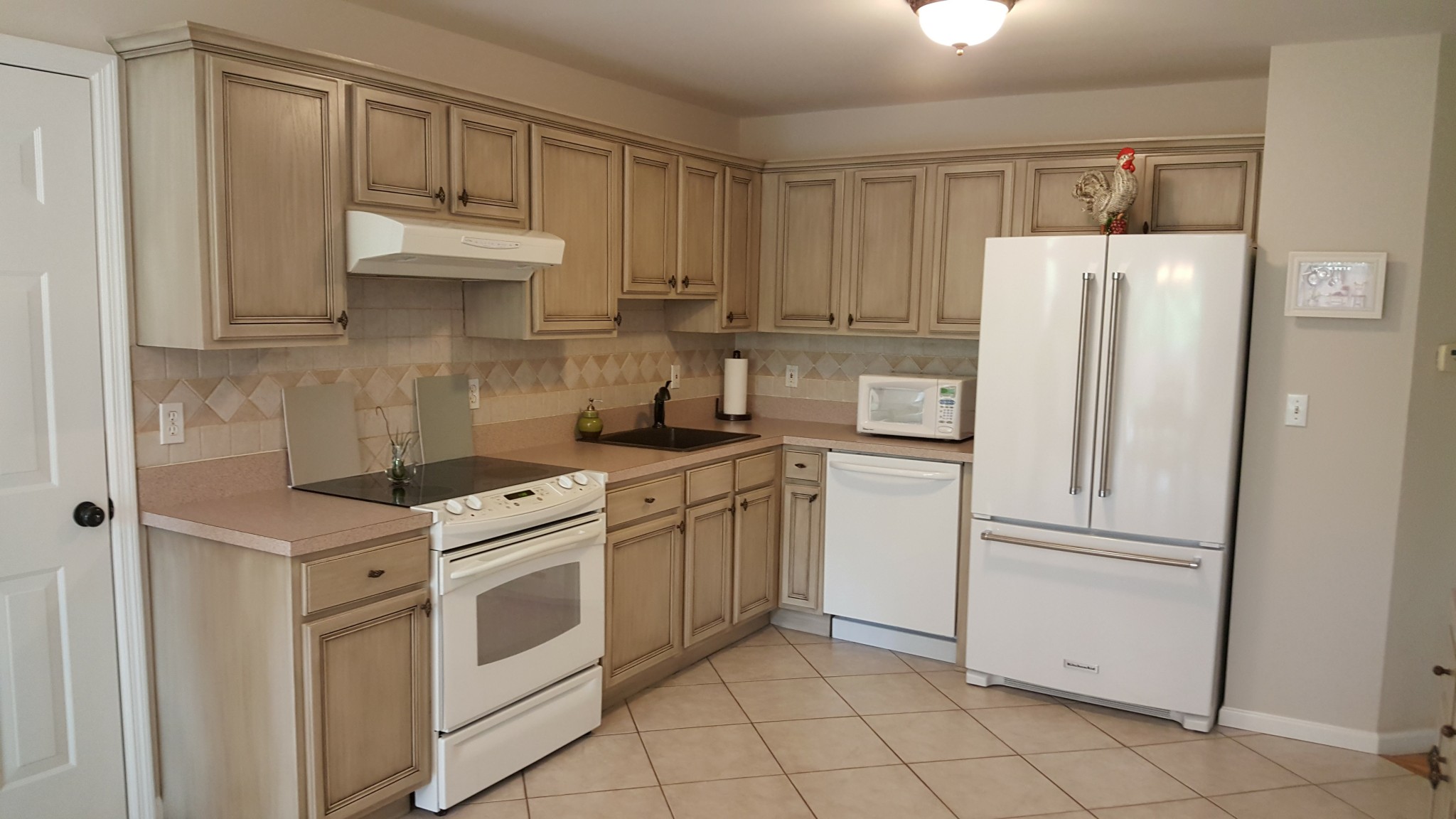 Kitchen cabinets and drawer fronts with glazed finish.