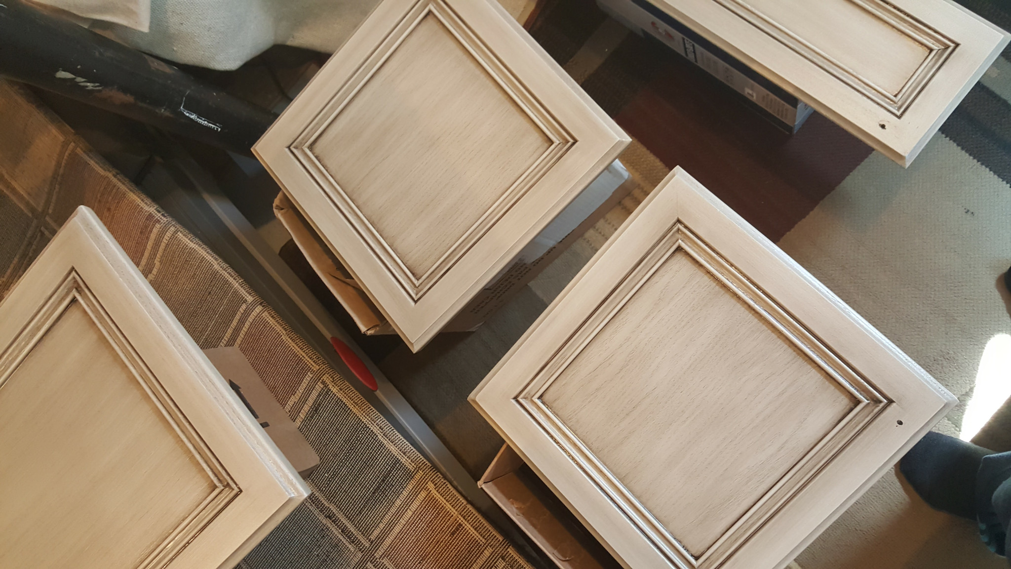 Cabinet doors laid out during the refinishing process