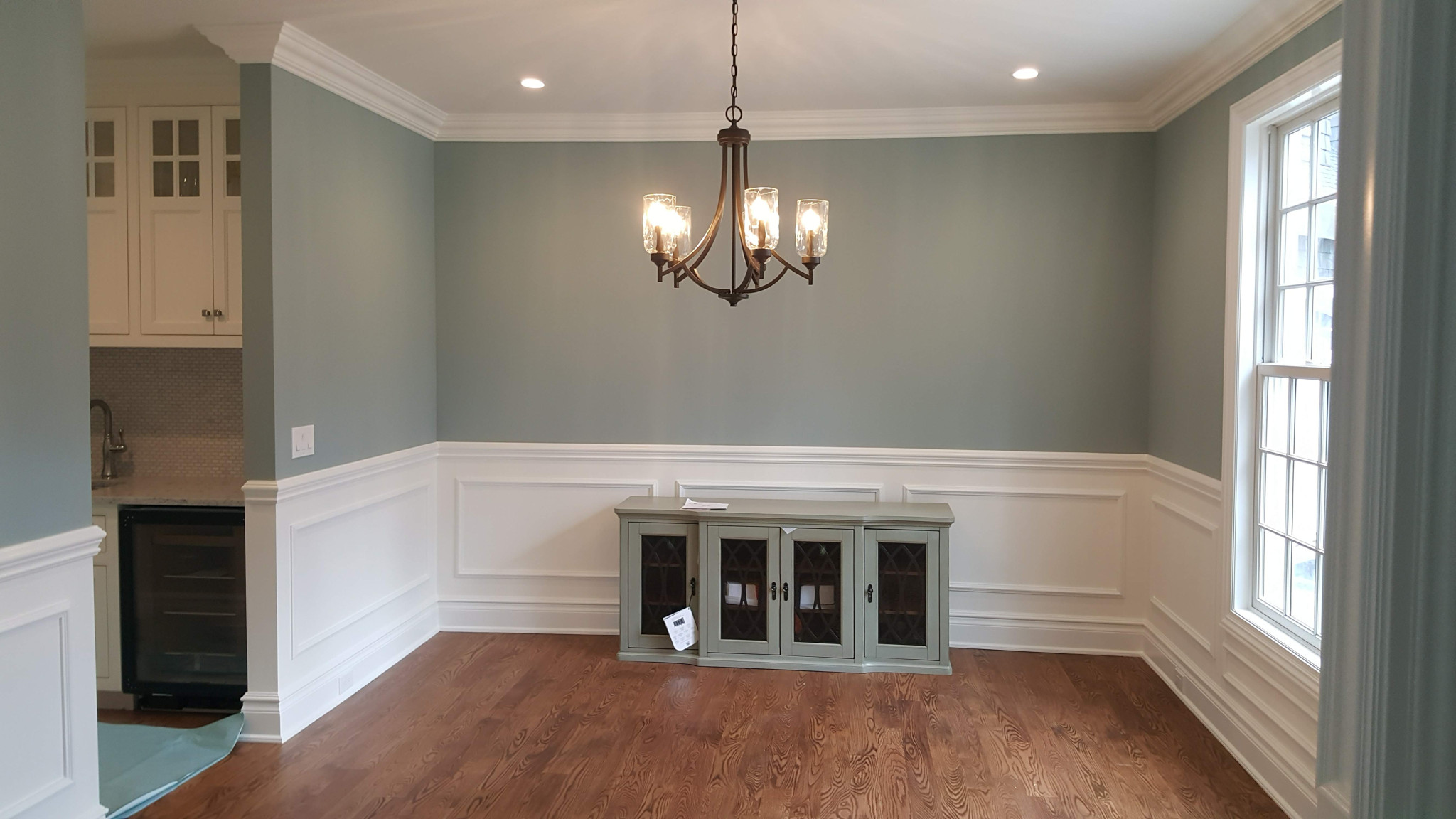 Dining room with wainscoting and crown molding