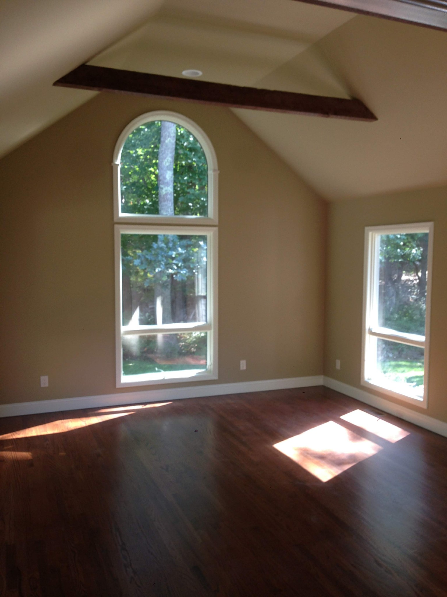 Interior room with freshly painted walls, ceilings, baseboards, and window trim.