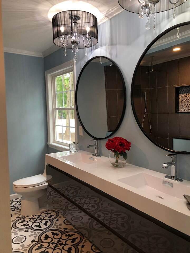 Light blue bathroom walls with white trim and off-white ceiling