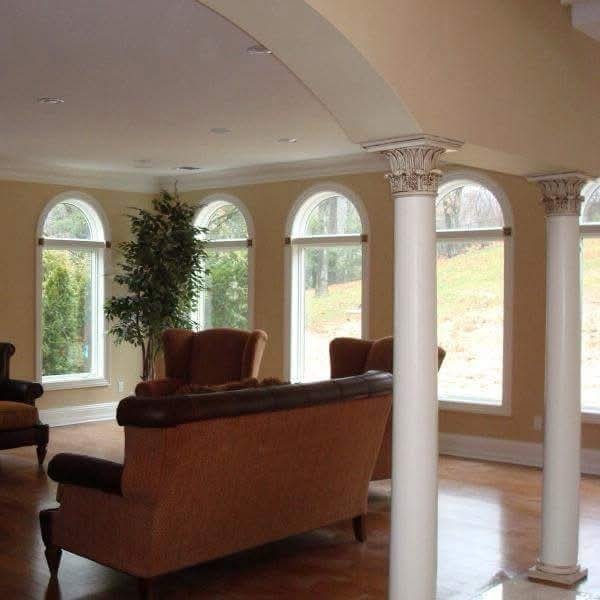 Off-white ceiling and light cream walls with painted white columns and trim.