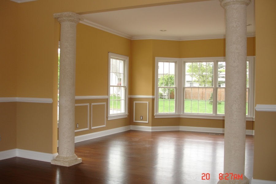 Recently painted walls, ceilings, and trim in an interior space with columns.