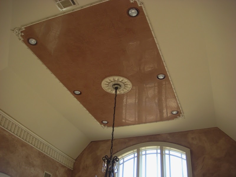 Ceiling medallion and rectangular ceiling recess with faux finish.
