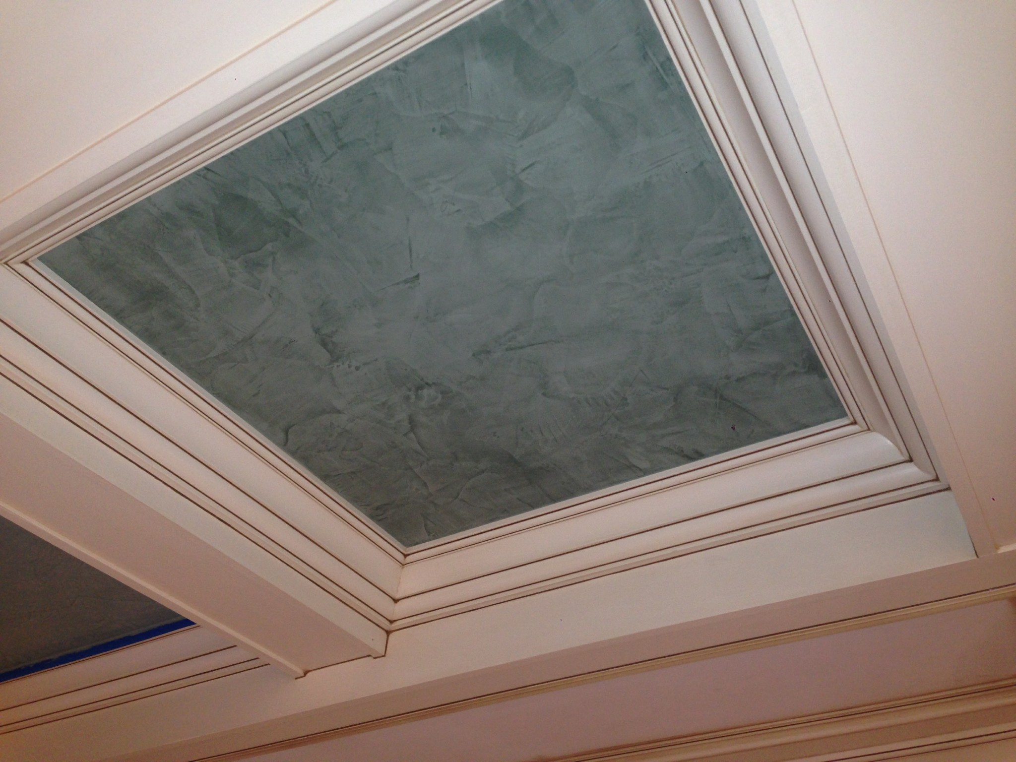 Ceiling recess with Venetian plaster finish and painted off-white trim.