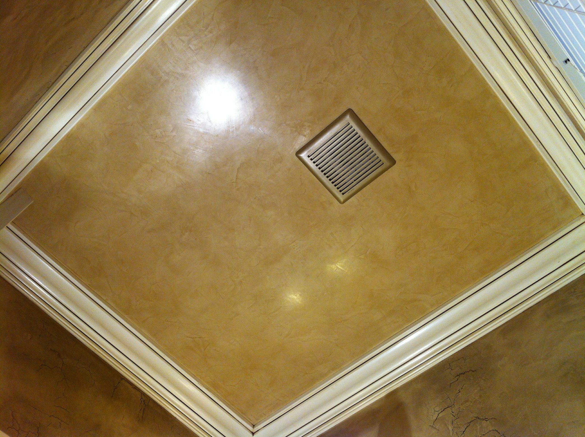 Coffered ceiling panels with faux finish and off-white trim painting.