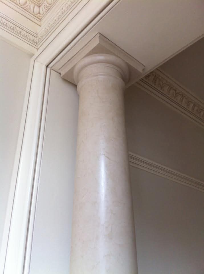 Column with faux marble finish and painted ceiling and wall trim.