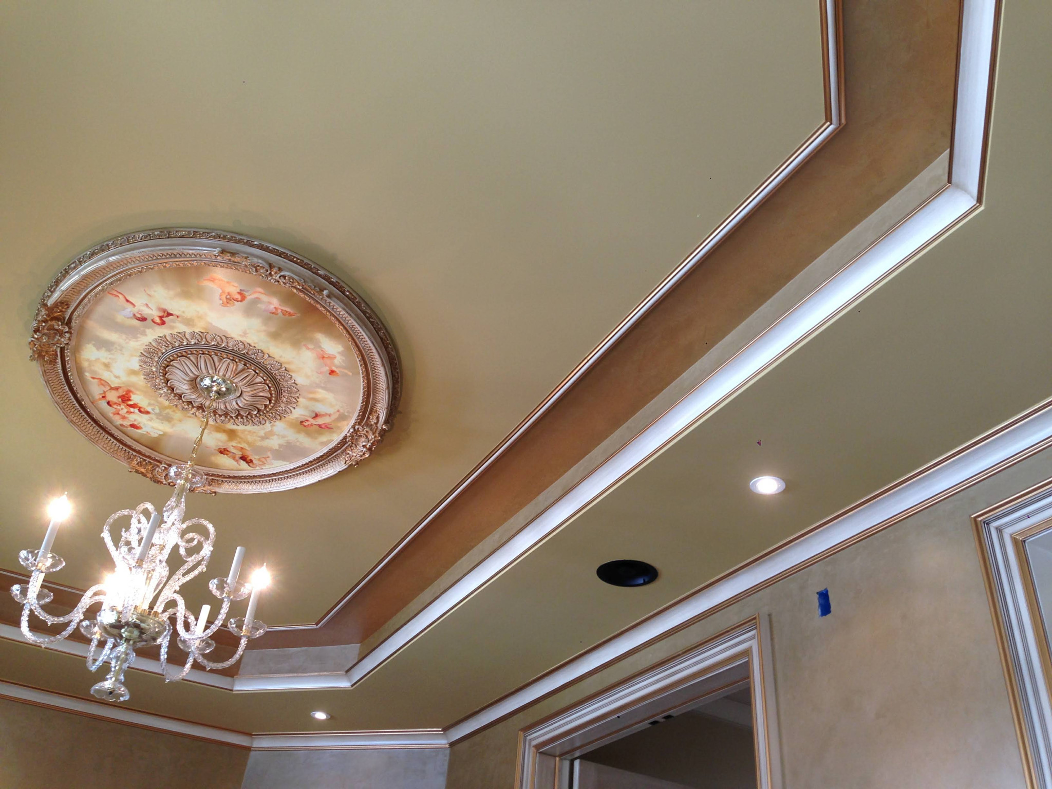 Tray ceiling with painted medallion and crown molding